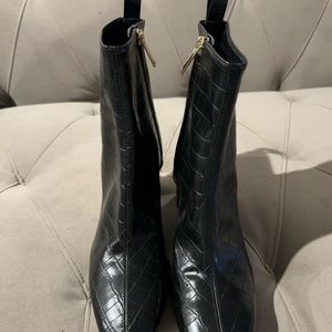 Women’s Black leather ankle boots.